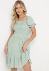 Zielona Sukienka z Bawełny z Elastycznym Dekoltem i Falbanką Loridia. Zielone sukienki damskie Born2be, na co dzień, m, bez wzorów, z bawełny, eleganckie, bez kołnierzyka, bez ramiączek, mini. Za 39.99 zł.