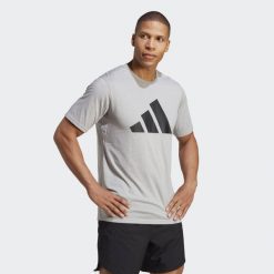 Koszulka adidas Essentials Feelready Logo. Białe koszulki sportowe męskie Adidas, s, bez wzorów, z bawełny, bez kołnierzyka, bez ramiączek, na fitness i siłownię. Za 140.35 zł.