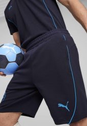 Męskie szorty Casuals Manchester City PUMA New Navy Magic Blue. Niebieskie szorty męskie Puma, na jesień, m, bez wzorów, z dzianiny, klasyczne. Za 192.10 zł.