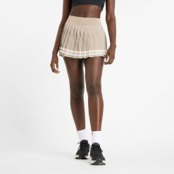 Spódnica damska New Balance WK51402ADS – beżowa. Brązowe spódnice damskie New Balance, m, bez wzorów, z materiału. Za 229.99 zł.
