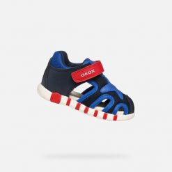 Sandały GEOX B SANDAL IUPIDOO BOY Niebieski. Niebieskie sandały męskie Geox, z syntetyku, bez zapięcia. Za 189.99 zł.