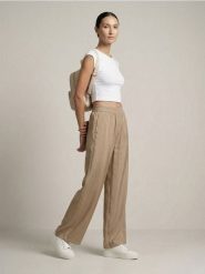 Spodnie wide leg z modalem - beżowy. Brązowe spodnie materiałowe damskie Sinsay, l, bez wzorów. Za 49.99 zł.