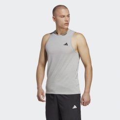 Train Essentials Feelready Training Sleeveless Tee. Białe buty sportowe męskie Adidas, z materiału, bez zapięcia, na fitness i siłownię. Za 131.00 zł.