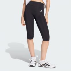 Legginsy Optime Essentials Capri. Czarne legginsy damskie Adidas, l, bez wzorów, z elastanu, do biegania, climacool (adidas). Za 199.00 zł.