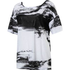 Puma Koszulka damska Dancer Drapey Tee czarno biała r. M (515721 07). Bluzki damskie marki Puma. Za 128.59 zł.