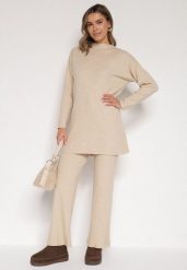 Beżowy Prążkowany Komplet Dzianinowy z Bawełną Sweter z Półgolfem i Spodnie Elweda. Brązowe spodnie materiałowe damskie Born2be, bez wzorów, z bawełny, klasyczne, bez kołnierzyka, bez ramiączek, długie, bez kaptura. Za 109.99 zł.