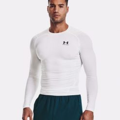 Koszulka męska Under Armour HG Armour Comp LS. Białe koszulki sportowe męskie Under Armour, l, bez wzorów, bez kołnierzyka, bez ramiączek, do biegania. Za 228.77 zł.