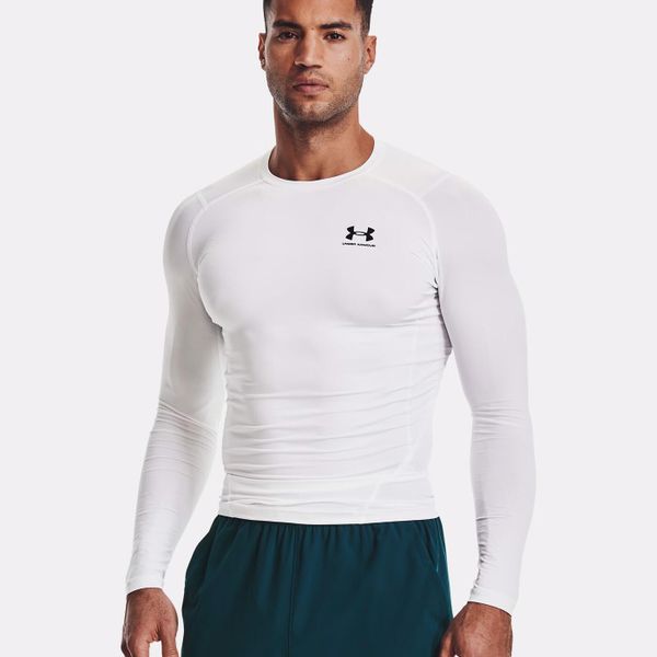 Koszulka męska Under Armour HG Armour Comp LS. Białe koszulki sportowe męskie Under Armour, m, bez wzorów, bez kołnierzyka, bez ramiączek, do biegania. Za 113.84 zł.