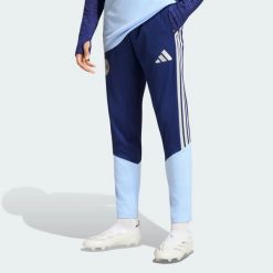 Spodnie treningowe Ajax Amsterdam 26/27 Tiro26. Niebieskie spodnie sportowe męskie Adidas, l, bez wzorów, z materiału, do biegania. Za 279.00 zł.