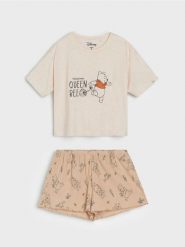 Piżama dwuczęściowa z nadrukiem Winnie the Pooh - kremowy. Białe piżamy damskie Sinsay, l, bez wzorów, bez ramiączek. Za 49.99 zł.