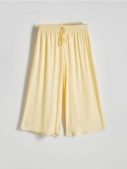 Spodnie culotte z wiskozy - jasnożółty. Żółte spodnie materiałowe damskie Reserved, l, bez wzorów, z tkaniny. W wyprzedaży za 59.99 zł.