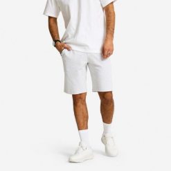 Spodenki fitness męskie Domyos regular. Szare buty sportowe męskie DOMYOS, z materiału, bez zapięcia, na fitness i siłownię. Za 79.99 zł.