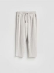 Spodnie z wiązaniem - jasnoszary. Szare spodnie materiałowe męskie Reserved, l, bez wzorów, z bawełny. Za 119.99 zł.