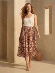 Wiskozowa spódnica midi w kwiatowy wzór - wielobarwny. Spódnice damskie Sinsay, l, bez wzorów, z wiskozy, midi. Za 39.99 zł.
