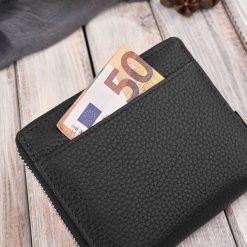 Paolo Peruzzi Portfel damski klasyczny skórzany czarny RFID T-139-BL. Czarne portfele damskie Paolo Peruzzi, bez wzorów. Za 130.47 zł.