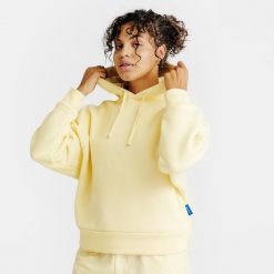 Bluza z kapturem damska Elementals. Żółte bluzy damskie Decathlon, s, bez wzorów, z bawełny, z kapturem. Za 179.99 zł.