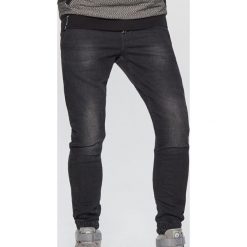 Jeansy SLIM JOGGER - Czarny. Jeansy męskie marki Cropp. Za 119.99 zł.