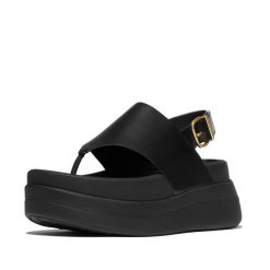 Kobiece sandały na koturnie ze skórzaną tylną paskiem FitFlop F-Mode. Czarne sandały damskie FIT FLOP, bez wzorów, z materiału, bez obcasa, na koturnie, bez zapięcia. Za 617.00 zł.