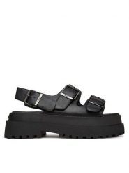 Buffalo Sandały Pluto Ari 1602268 Czarny. Czarne sandały damskie Buffalo, bez wzorów, ze skóry, bez obcasa, na koturnie, bez zapięcia. Za 219.99 zł.