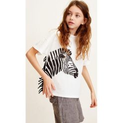 Mango Kids - Top dziecięcy Zebra 110-152 cm. Białe t-shirty i topy dla dziewczynek Mango Kids, bez wzorów, z bawełny, bez ramiączek. W wyprzedaży za 29.90 zł.