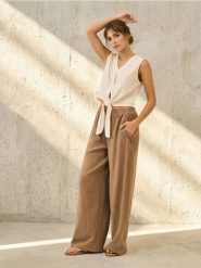 Spodnie wide leg z wikozą - beżowy. Brązowe spodnie materiałowe damskie Sinsay, l, bez wzorów. Za 59.99 zł.