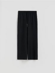 Luźne spodnie z lnem - czarny. Czarne spodnie materiałowe damskie Reserved, l, bez wzorów, z wiskozy. Za 129.99 zł.