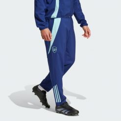 Spodnie Arsenal Tiro 24 Presentation. Niebieskie spodnie sportowe męskie Adidas, l, bez wzorów, z dresówki, do piłki nożnej. Za 299.00 zł.