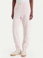 Lacoste Spodnie dresowe XF5244 Różowy jasny Regular Fit. Czerwone spodnie dresowe damskie Lacoste, bez wzorów, z dresówki. Za 639.99 zł.