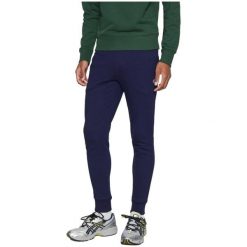 Spodnie Lacoste slim fit z organicznej bawełny granatowe. Niebieskie spodnie sportowe męskie Lacoste, m, bez wzorów, z bawełny, na fitness i siłownię. Za 510.45 zł.
