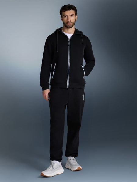 4F Bluza dresowa regular z kapturem męska - czarny M. Czarne bluzy męskie 4f, m, bez wzorów, z bawełny, z kapturem, do biegania. Za 269.99 zł.