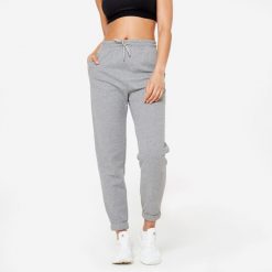Spodnie dresowe damskie Domyos Gym & Pilates. Szare obuwie sportowe damskie DOMYOS, l, bez wzorów, z bawełny. Za 89.99 zł.