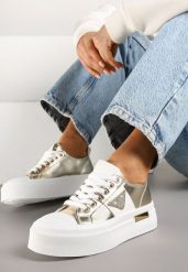 Złote Trampki na Grubej Podeszwie z Cyrkoniową Naszywką Penirea. Żółte obuwie sportowe damskie Renee, z aplikacjami, sportowe, bez zapięcia. Za 69.99 zł.