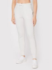 Guess Spodnie dresowe V2YB18 K7UW2 Biały Regular Fit. Białe spodnie dresowe damskie Guess, xxs, z aplikacjami, z dresówki. Za 189.99 zł.