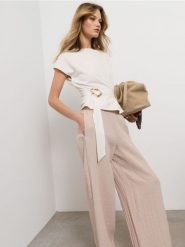 Spodnie wide leg z wiskozą - beżowy. Brązowe spodnie materiałowe damskie Sinsay, l, bez wzorów, z wiskozy. Za 49.99 zł.