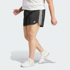 Szorty Pacer Training 3-Stripes Woven High-Rise (Plus Size). Białe legginsy damskie Adidas, plus size, bez wzorów, z materiału, sportowe, na fitness i siłownię. W wyprzedaży za 127.20 zł.