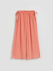 Szerokie spodnie z modalem - pomarańczowy. Brązowe spodnie materiałowe damskie Reserved, l, bez wzorów, z tkaniny. Za 119.99 zł.