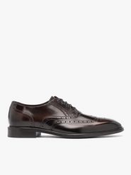 Ciemnobrązowe eleganckie półbuty. Brązowe eleganckie półbuty Ryłko, z lakierowanej skóry, eleganckie, przed kostkę, bez zapięcia. Za 499.99 zł.