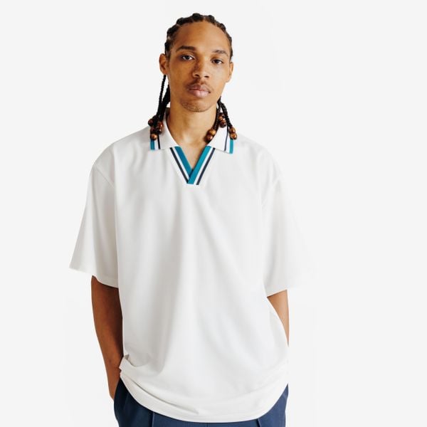 Koszulka polo oversize męska Heritage. Niebieskie koszulki polo męskie Decathlon, m, bez wzorów, z materiału, bez kołnierzyka, bez ramiączek, na golfa. Za 69.99 zł.