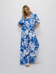 Wzorzyste spodnie palazzo - niebieski. Niebieskie spodnie materiałowe damskie Reserved, l, bez wzorów, z tkaniny. W wyprzedaży za 45.99 zł.