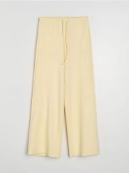 Spodnie wide leg z miękkiej dzianiny z domieszką wiskozy soft touch - żółty. Żółte spodnie materiałowe damskie Sinsay, l, bez wzorów, z dzianiny. Za 49.99 zł.