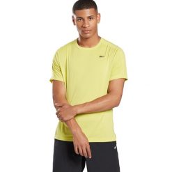 Koszulka sportowa męska Reebok Ubf Perforated. Żółte koszulki sportowe męskie Reebok, l, bez wzorów, z dresówki, bez kołnierzyka, bez ramiączek, na fitness i siłownię. Za 184.00 zł.