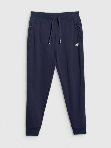4F Spodnie dresowe joggery męskie - granatowe M. Niebieskie spodnie sportowe męskie 4f, m, bez wzorów, z dresówki, na fitness i siłownię. Za 149.99 zł.
