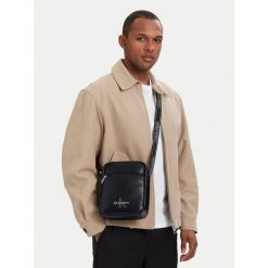 Saszetka Calvin Klein. Czarne saszetki męskie Calvin Klein, młodzieżowe, małe. Za 369.99 zł.