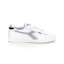 Trampki damskie DIADORA GAME L LOW ZIG ZAG WN. Białe obuwie sportowe damskie Diadora, bez wzorów, bez zapięcia. Za 179.99 zł.