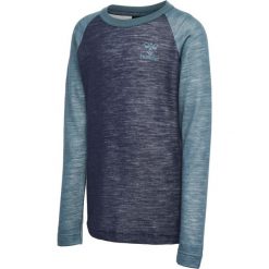 Koszulka dla dziewczynki Hummel Wingo. Niebieskie bluzki dla dziewczynek Hummel, bez wzorów, z wełny, bez kołnierzyka, bez ramiączek. Za 189.00 zł.