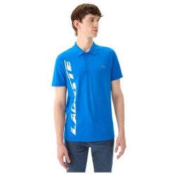 Koszulka sportowa polo męska Lacoste Polo. Niebieskie koszulki polo męskie Lacoste, m, bez wzorów, z jeansu, eleganckie, bez ramiączek. Za 377.00 zł.
