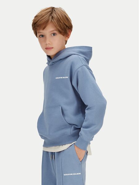 Calvin Klein Jeans Bluza IB0IB02618 Niebieski Relaxed Fit. Niebieskie bluzy dla chłopców Calvin Klein Jeans, bez wzorów, z jeansu, bez ramiączek, bez kaptura. Za 329.99 zł.
