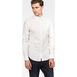 G-Star Raw - Koszula Core. Szare koszule męskie G-Star Raw, z bawełny, z klasycznym kołnierzykiem, z długim rękawem. W wyprzedaży za 199.90 zł.