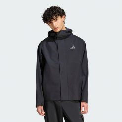 KURTKA PRZECIWDESZCZOWA ESSENTIALS. Szare kurtki męskie Adidas, l, bez wzorów, z materiału, bez kaptura. Za 439.00 zł.