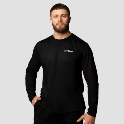Koszulka męska fitness z długim rękawem czarna Basic. Czarne koszulki sportowe męskie GYMBEAM, m, bez wzorów, z bawełny, bez kołnierzyka, bez ramiączek, na fitness i siłownię. Za 68.90 zł.